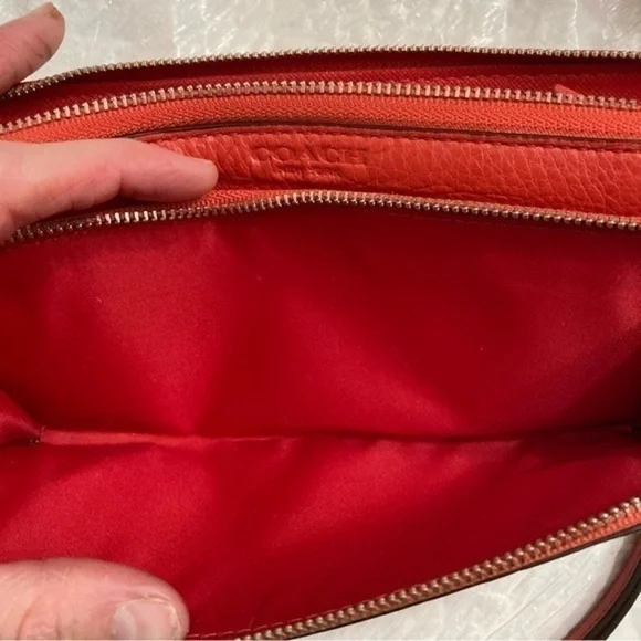 Coach orangy red leather double zipper wristlet clutch bag